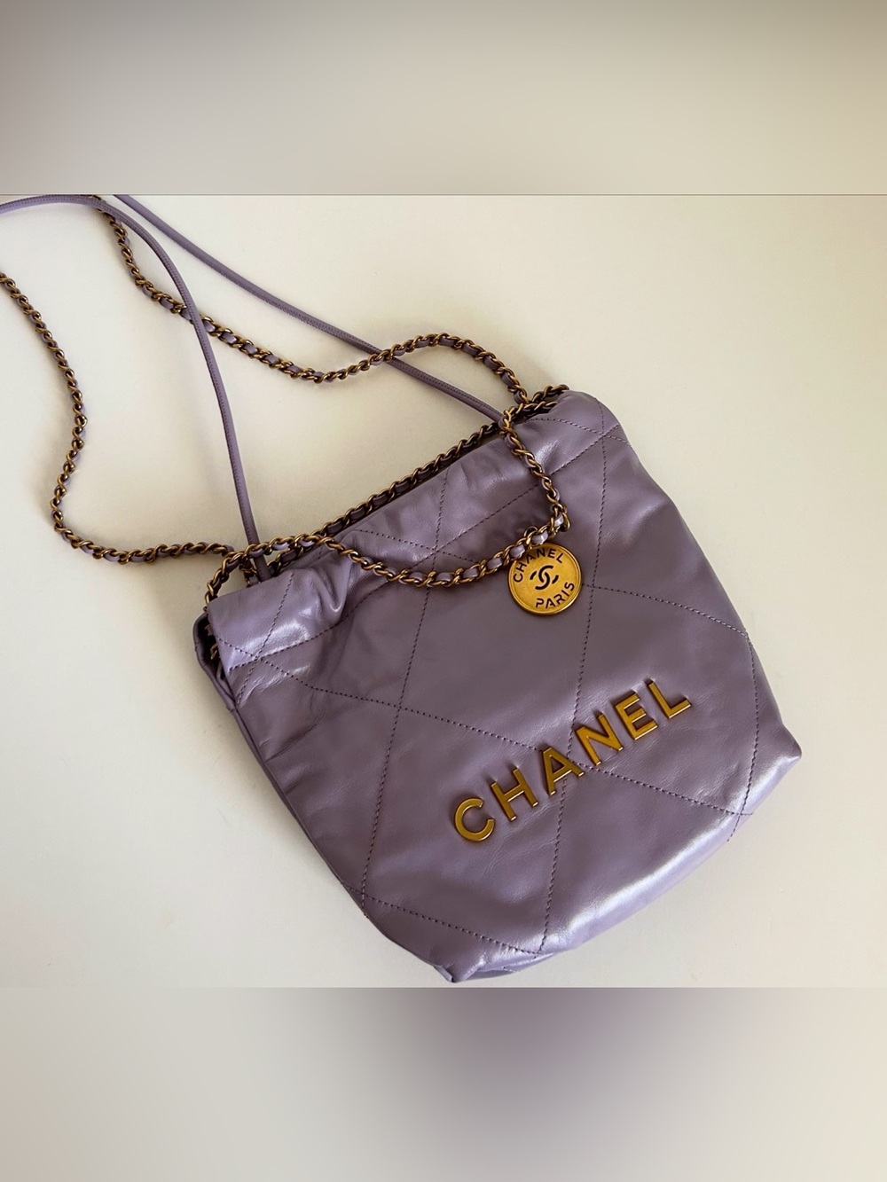 CHANEL Mini 22 Lavender Quilted Leather Crossbody with Gold Logo Medallion